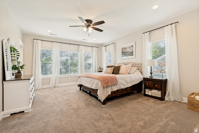 332 South 500 West Payson, UT 84651 - Photo 15 of 50 Spacious primary bedroom with light-colored carpeting, multiple windows providing natural light, a ceiling fan, and recessed lighting