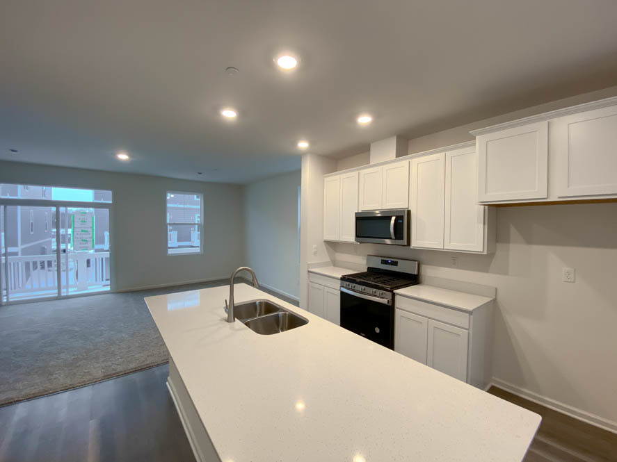 561 Yosemite Way Mundelein, IL 60060 - Photo 8 of 48 a kitchen with a sink a stove and refrigerator