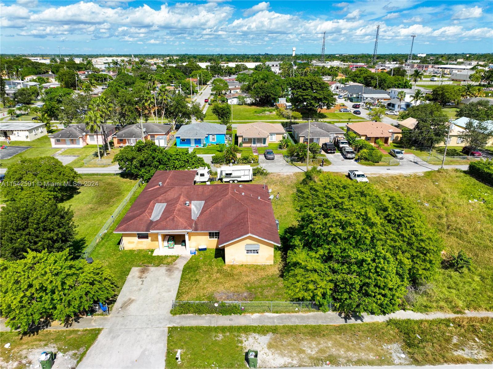 657 Southwest 7th Street Homestead, FL 33030 - Photo 1 of 33 an aerial view of multiple houses with yard