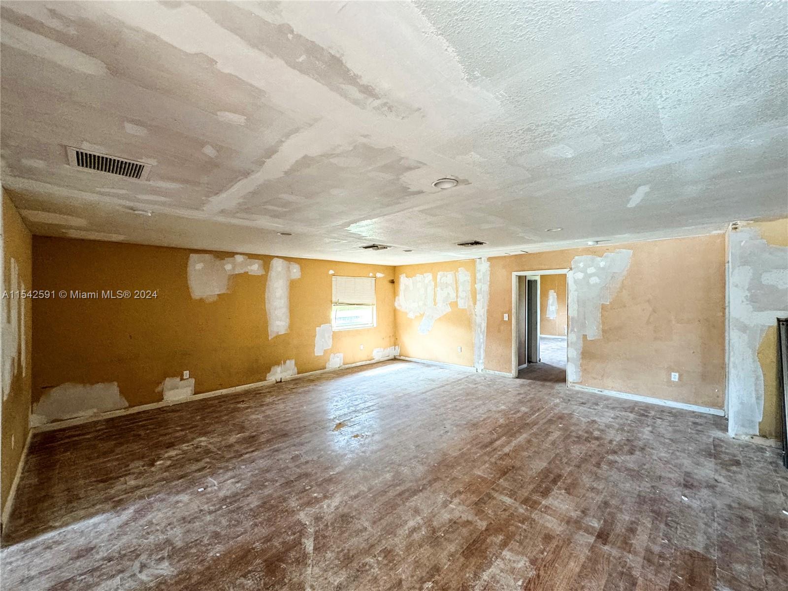 657 Southwest 7th Street Homestead, FL 33030 - Photo 14 of 33 a view of an empty room with a window