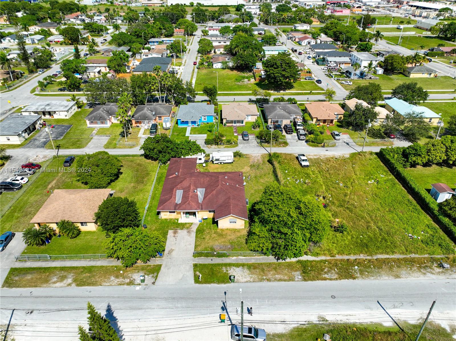 657 Southwest 7th Street Homestead, FL 33030 - Photo 2 of 33 an aerial view of residential houses with outdoor space