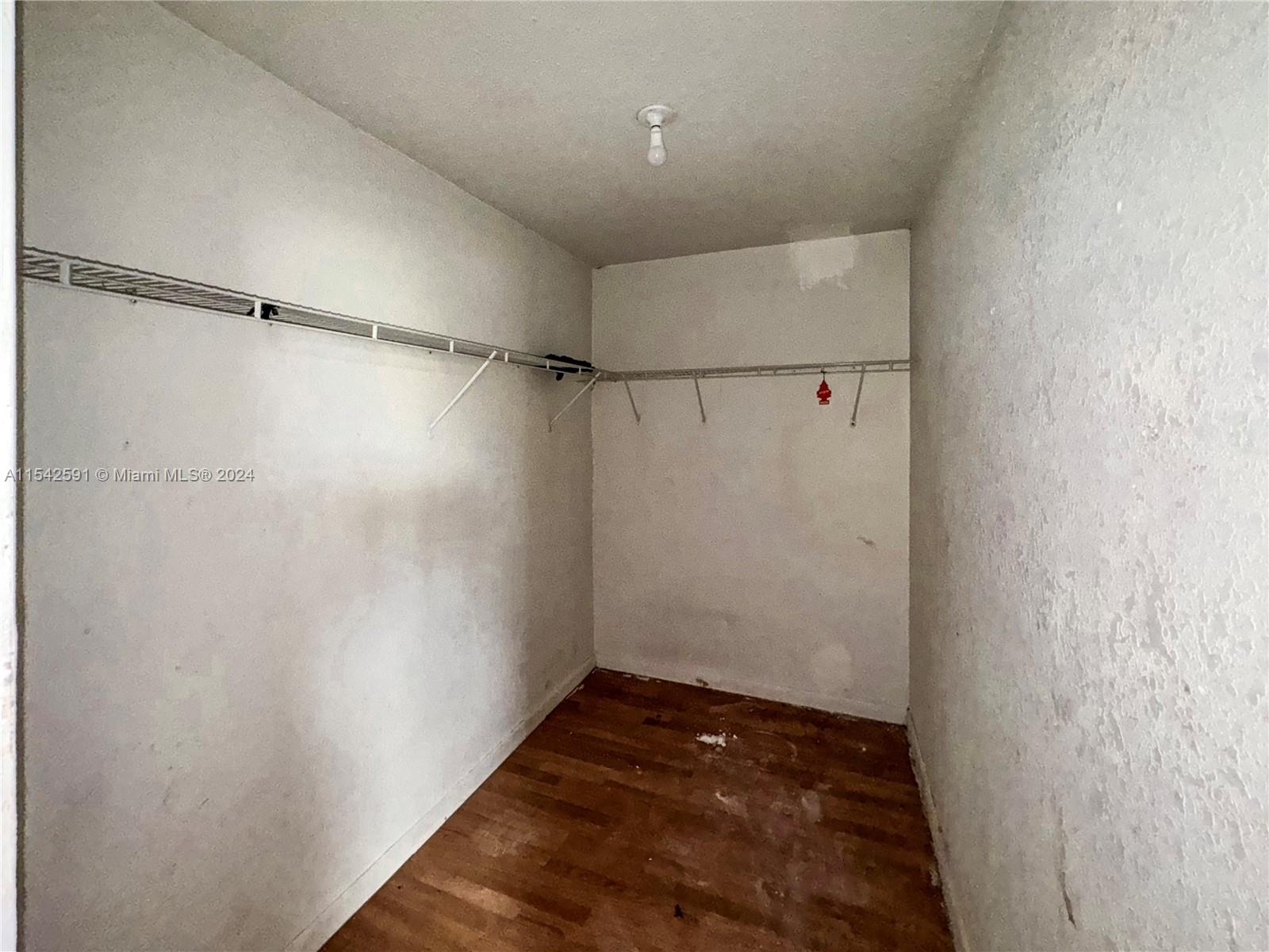 657 Southwest 7th Street Homestead, FL 33030 - Photo 24 of 33 a view of a walk in closet