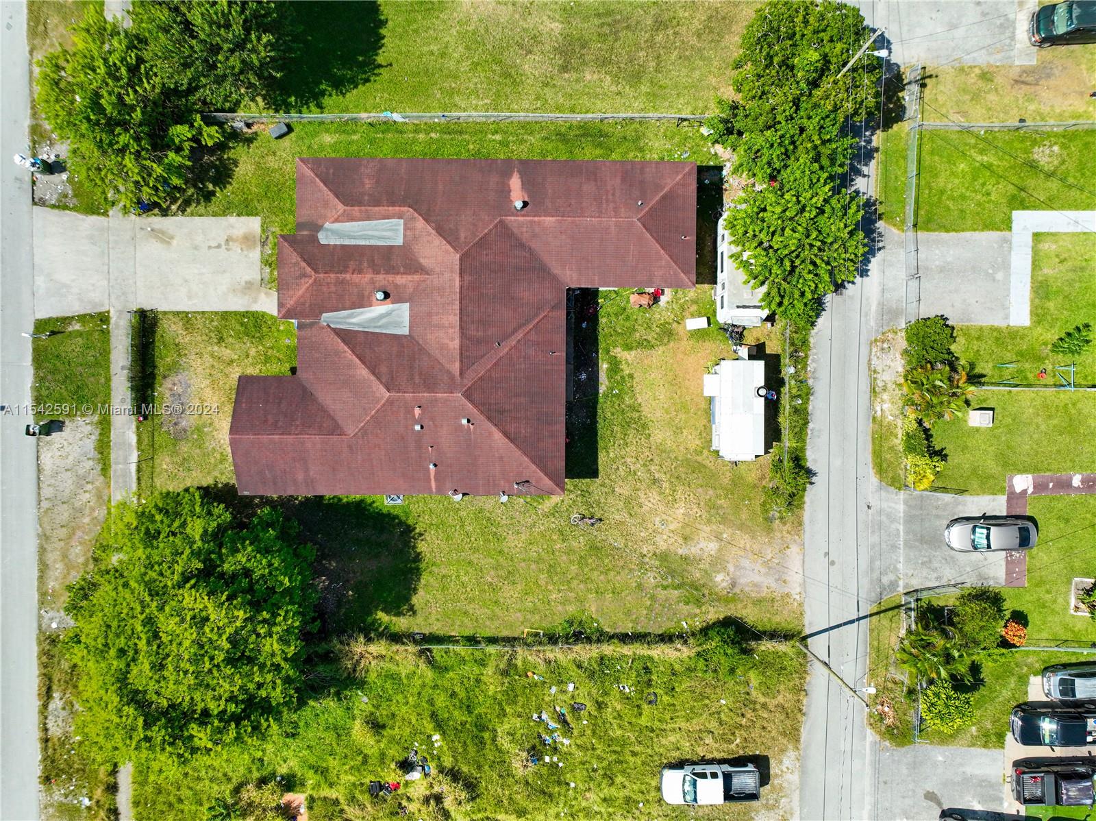 657 Southwest 7th Street Homestead, FL 33030 - Photo 6 of 33 an aerial view of residential houses with outdoor space and street view