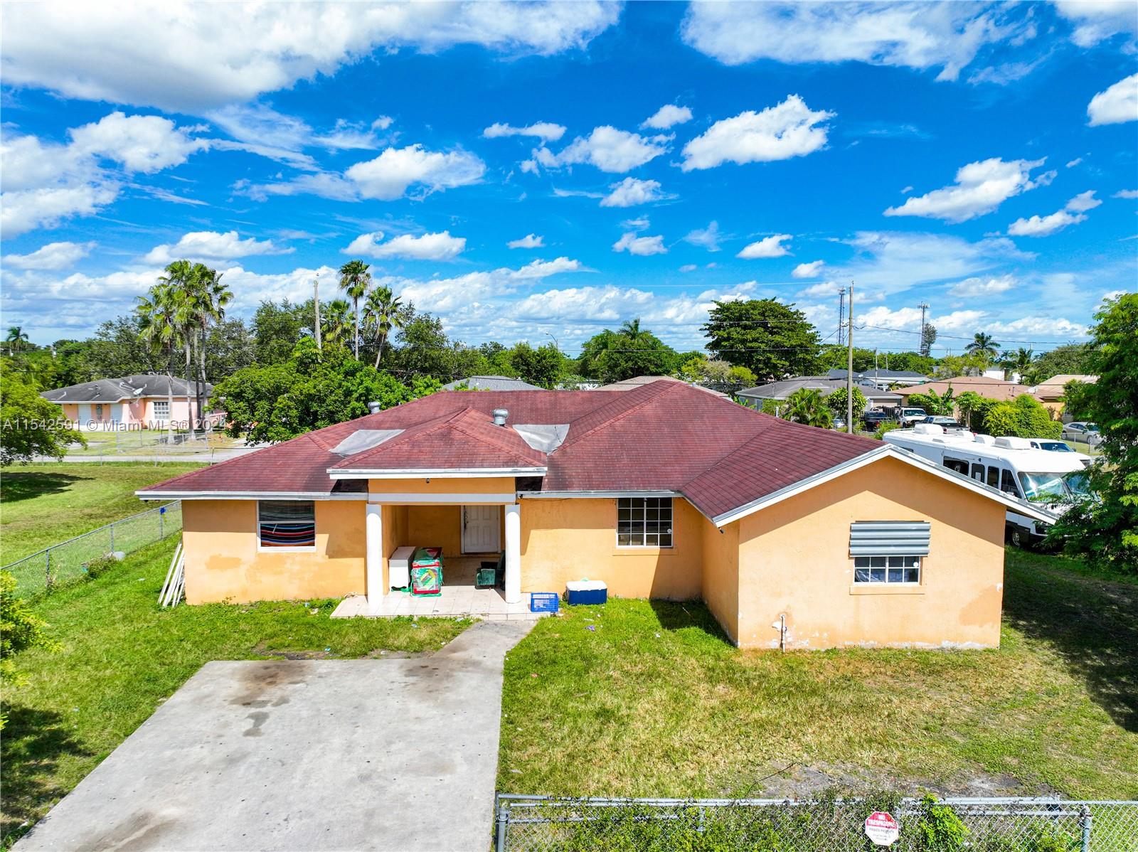 657 Southwest 7th Street Homestead, FL 33030 - Photo 8 of 33 a front view of a house with garden