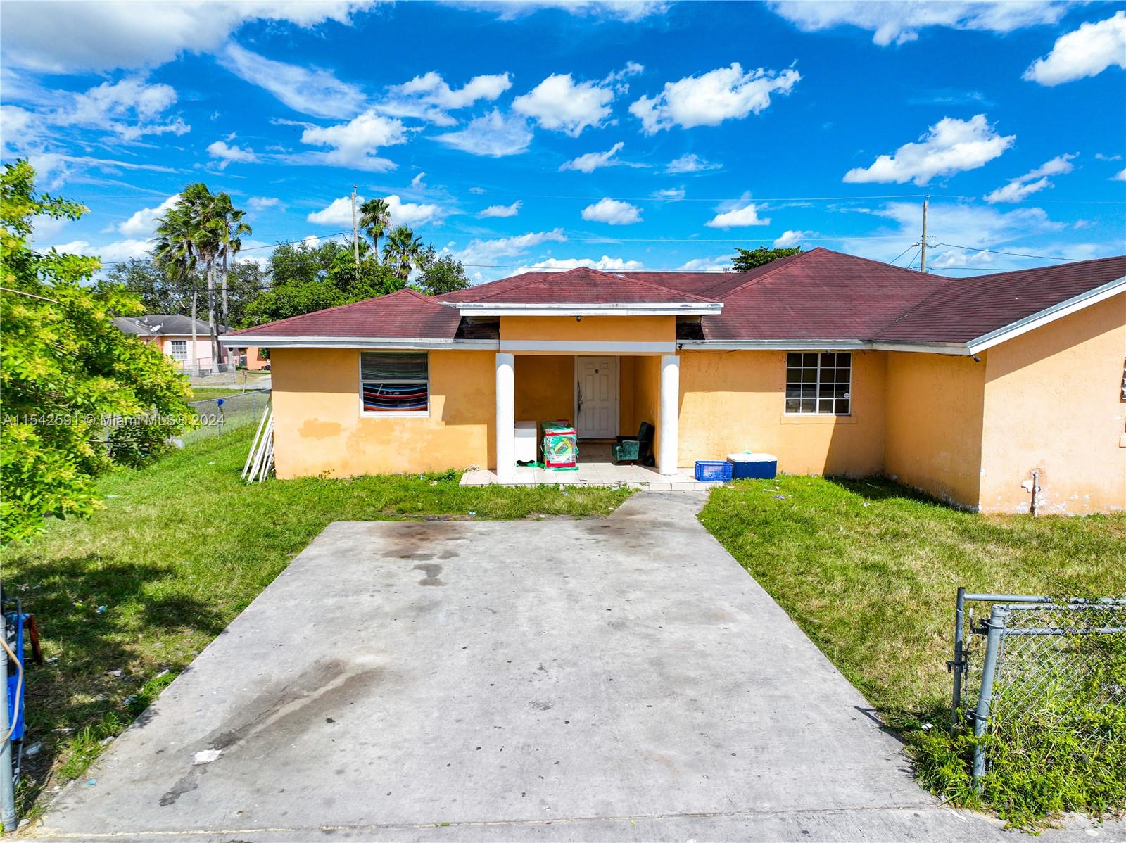 657 Southwest 7th Street Homestead, FL 33030 - Photo 10 of 33 a front view of a house with a garden