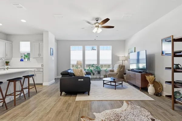 a living room with furniture and a large window