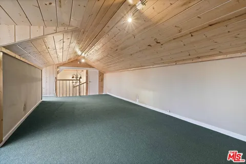 a view of empty room with windows