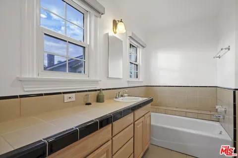 a bathroom with a sink and a bathtub