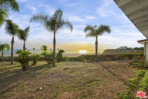 a view of lake with palm trees