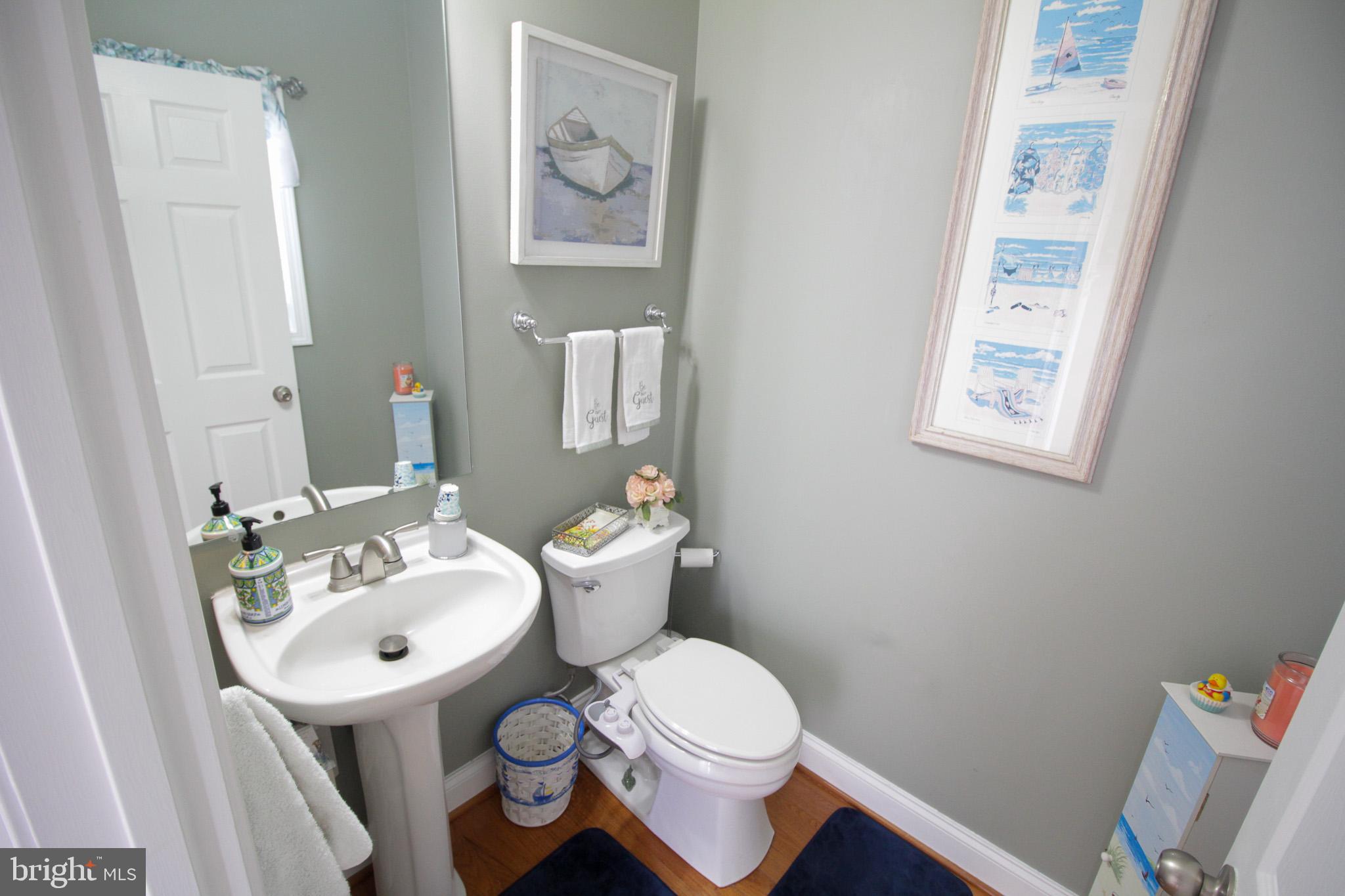 32377 Back Nine Way, Unit 3747 Long Neck, DE 19966 - Photo 23 of 41 a bathroom with a sink toilet and mirror