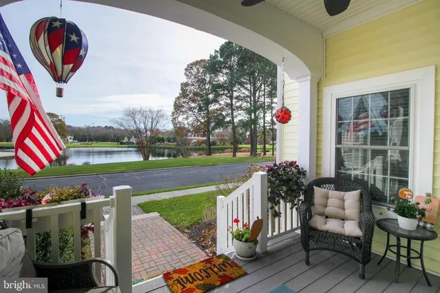 a front view of a house with garden and outdoor seating