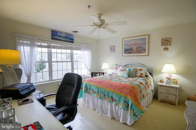 a bedroom with a bed and a chair