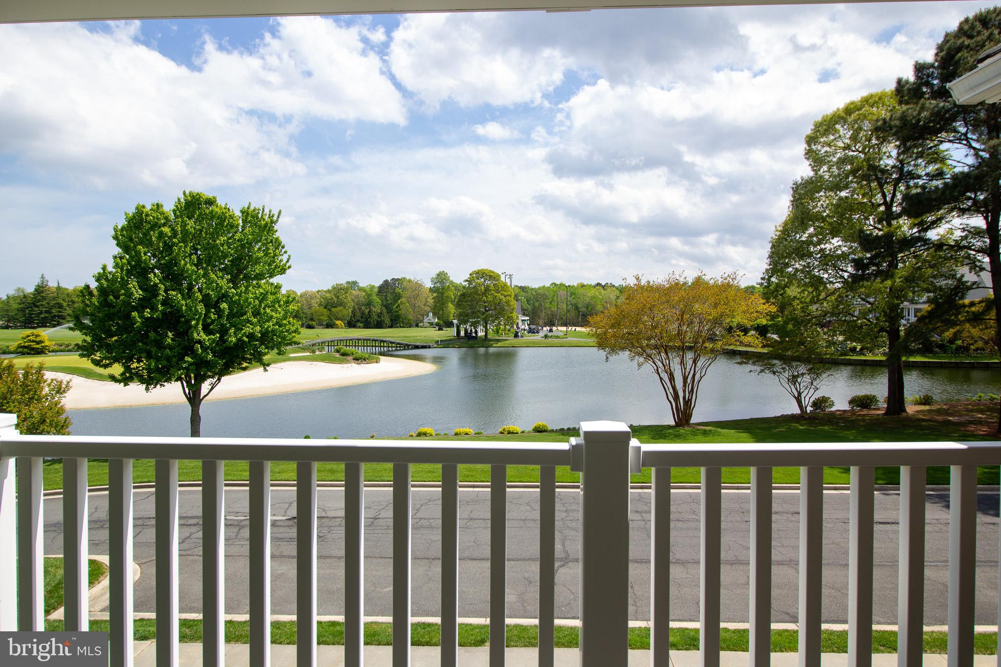 32377 Back Nine Way, Unit 3747 Long Neck, DE 19966 - Photo 31 of 41 a balcony with wooden floor and lake view