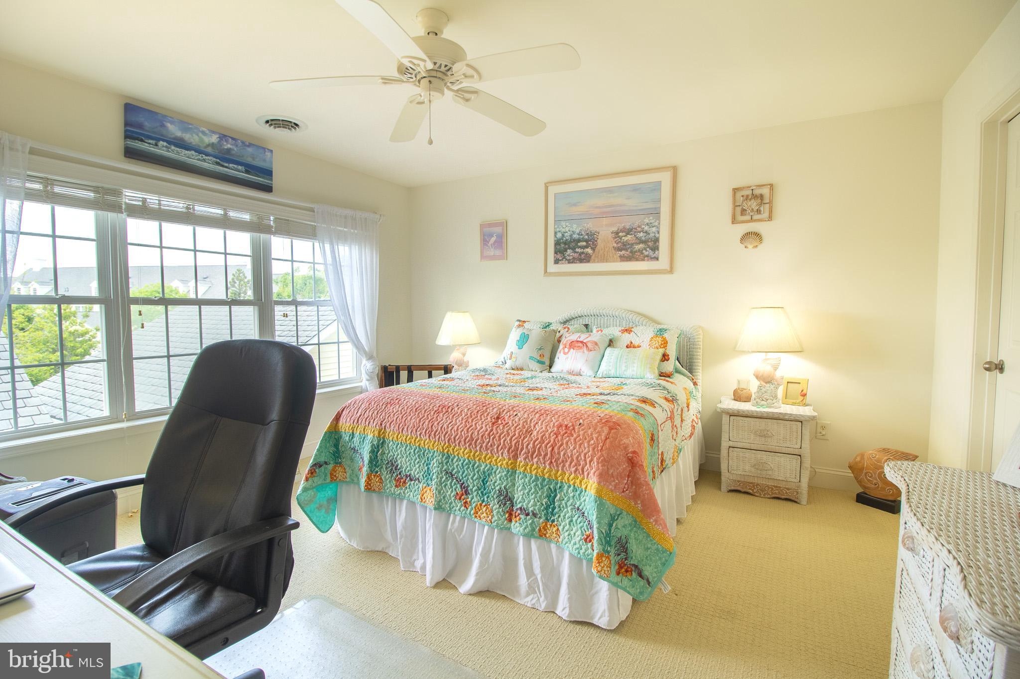 32377 Back Nine Way, Unit 3747 Long Neck, DE 19966 - Photo 33 of 41 a bedroom with a bed and a chair
