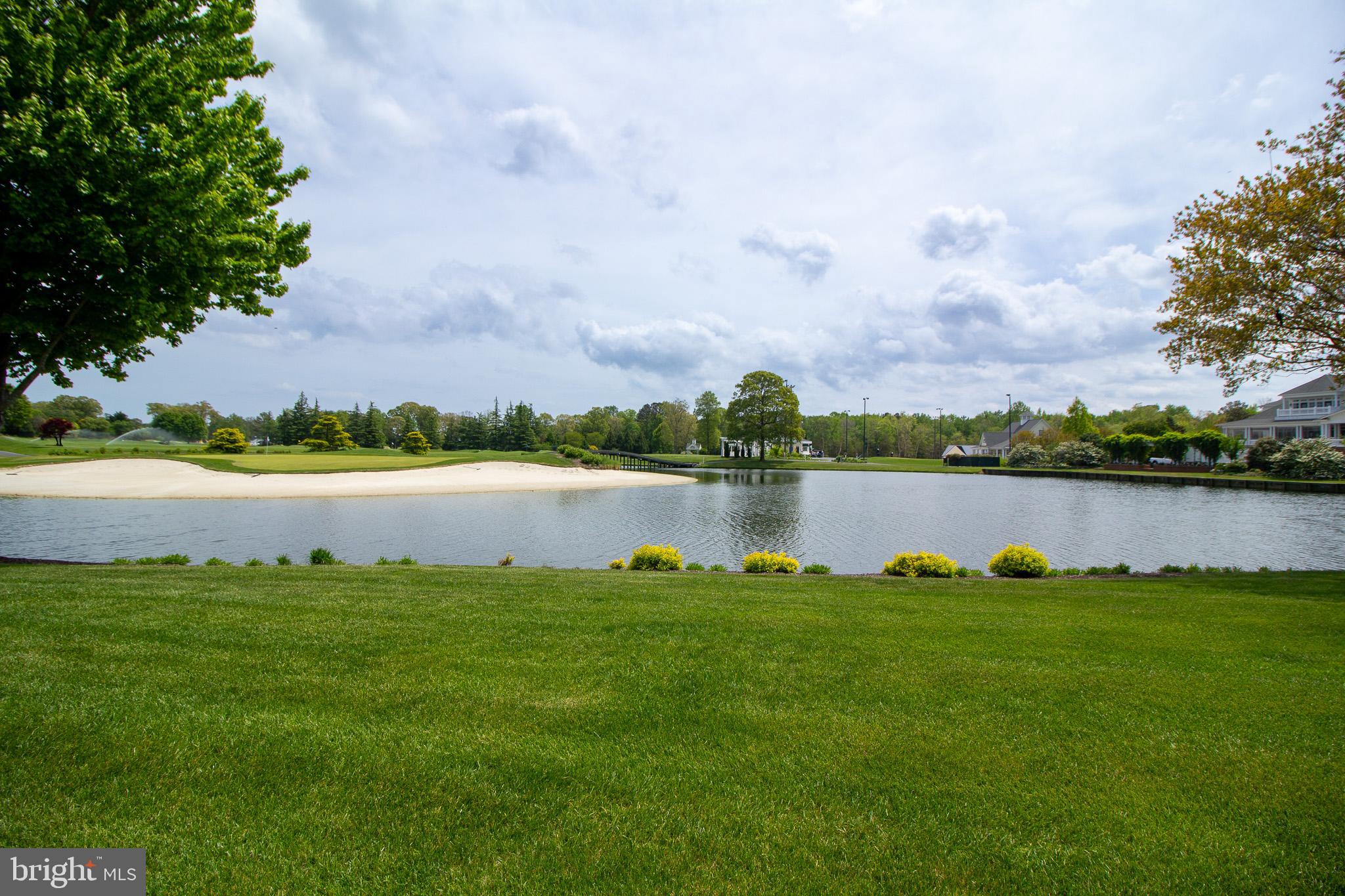 32377 Back Nine Way, Unit 3747 Long Neck, DE 19966 - Photo 4 of 41 a view of a lake with houses in the background