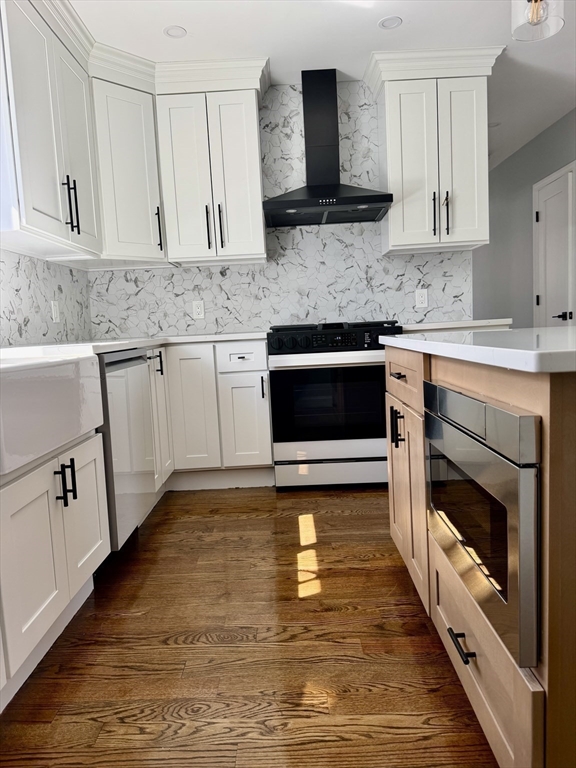 60-62 Wellsmere Road, Unit 1 Boston, MA 02131 - Photo 2 of 19 a kitchen with granite countertop a stove top oven sink and cabinets