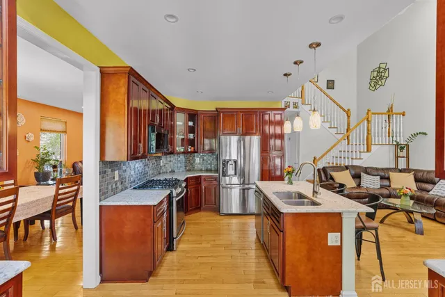 a kitchen with sink a stove and cabinets
