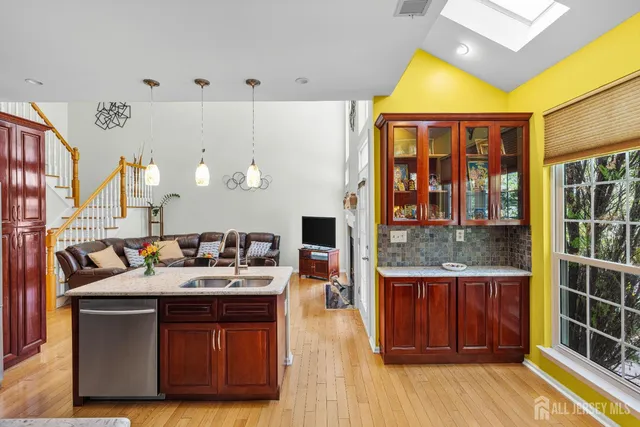 a living room with furniture fireplace and flat screen tv