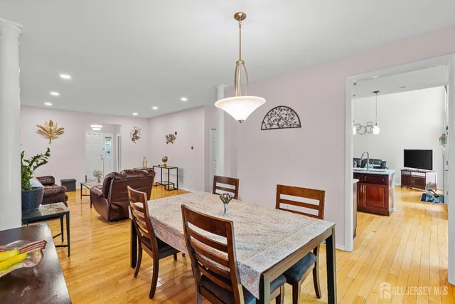 a view of a bedroom with furniture and a window