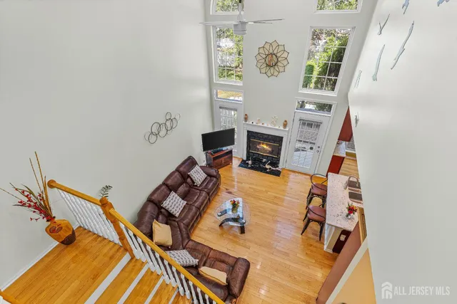 a view of a bedroom with furniture and window