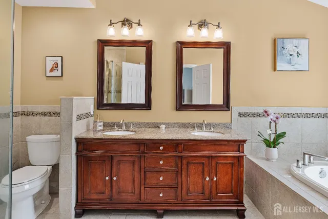 a bathroom with a tub and a window