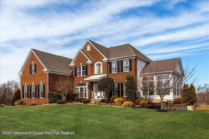 5 Jake Drive Cream Ridge, NJ 08514 - Photo 1 of 64 a front view of a house with a garden and trees