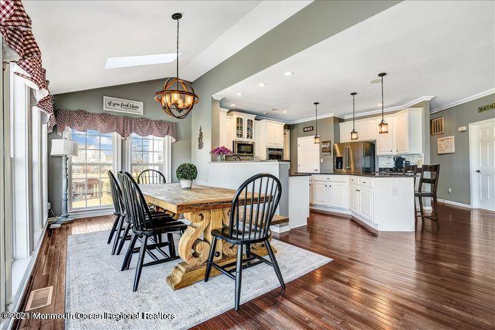 5 Jake Drive Cream Ridge, NJ 08514 - Photo 18 of 64 a dining room with stainless steel appliances kitchen island granite countertop a table chairs and a chandelier