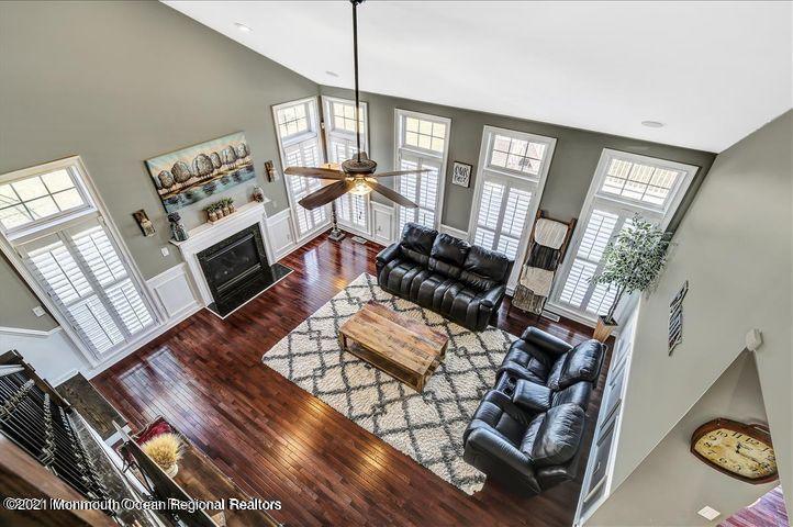 5 Jake Drive Cream Ridge, NJ 08514 - Photo 21 of 64 a living room with furniture a fireplace and a flat screen tv