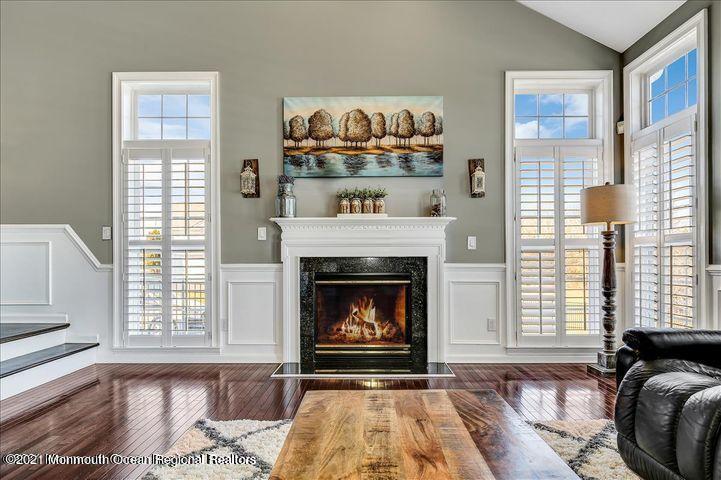 5 Jake Drive Cream Ridge, NJ 08514 - Photo 22 of 64 a living room with a fireplace and a large window
