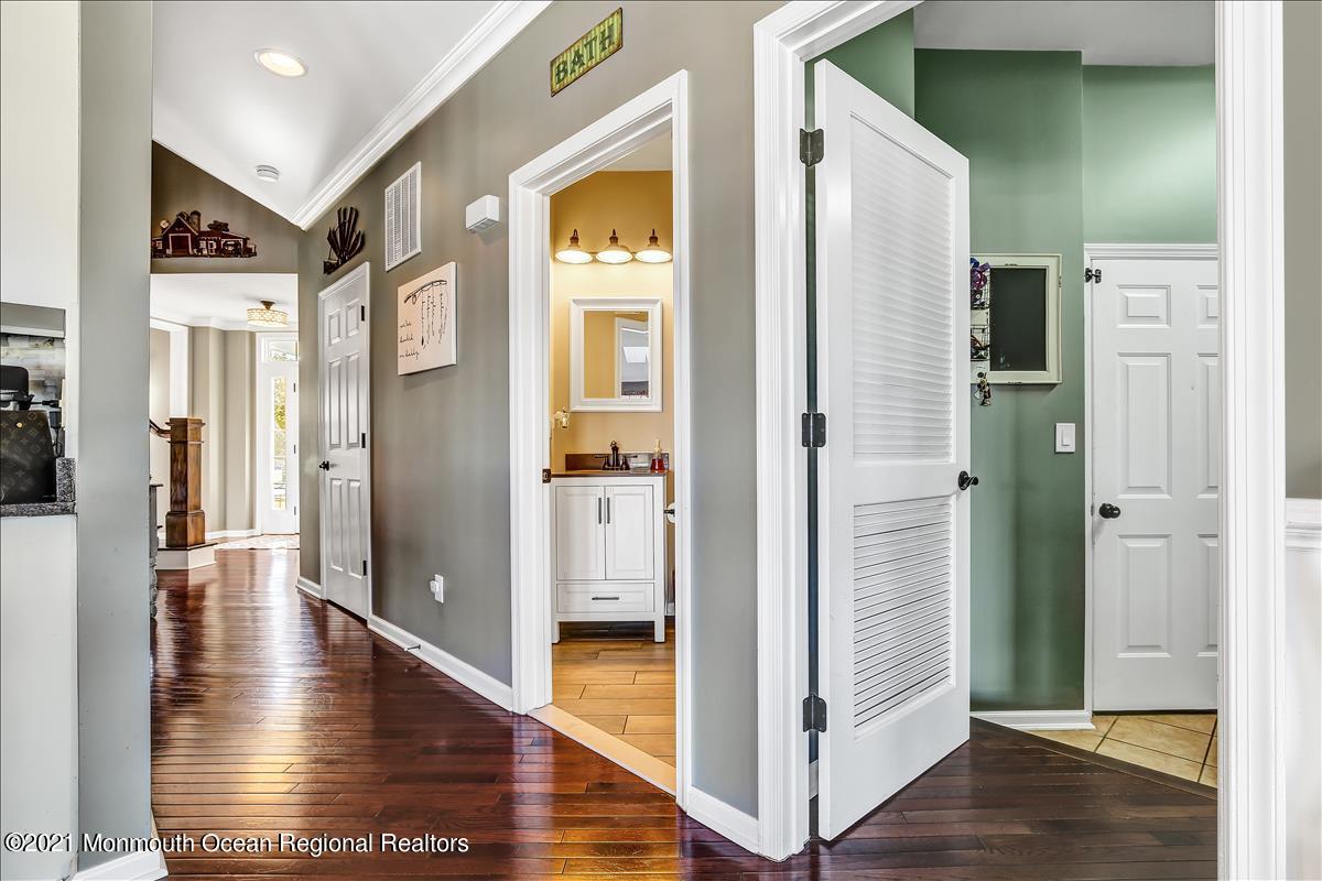 5 Jake Drive Cream Ridge, NJ 08514 - Photo 30 of 64 a view of a hallway with wooden floor and living room