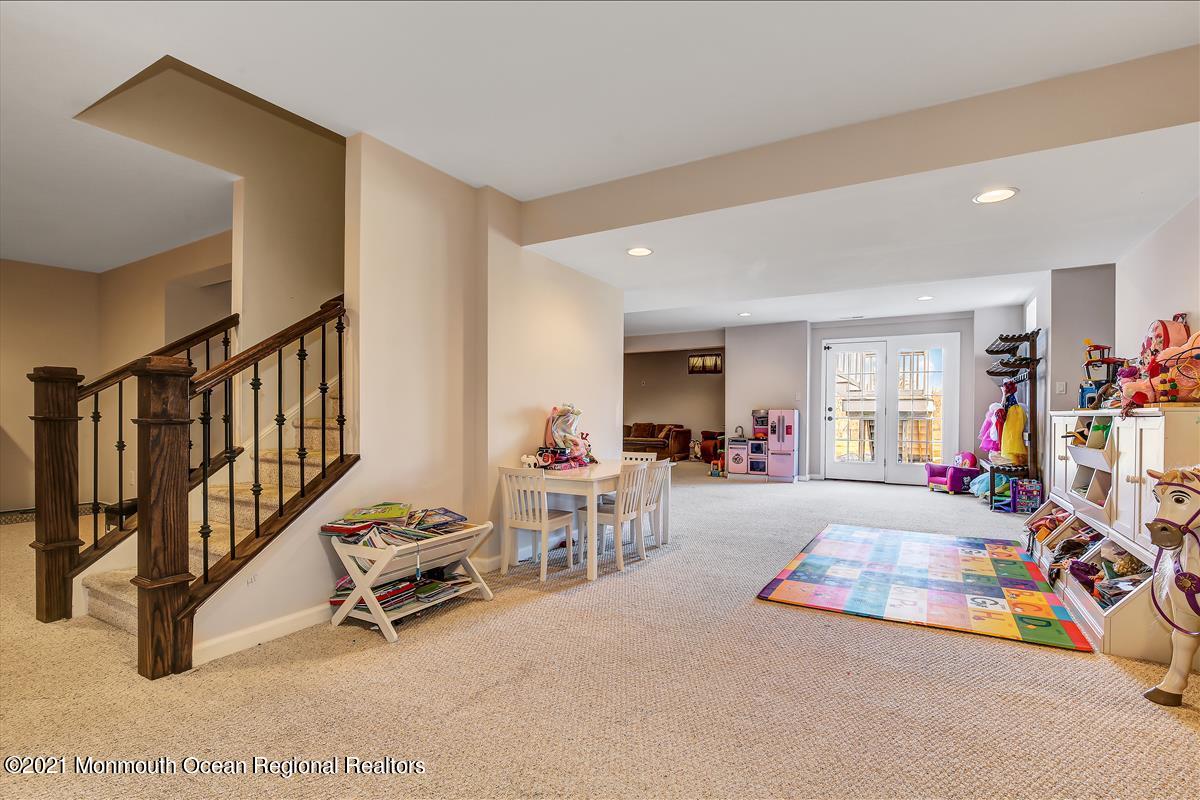5 Jake Drive Cream Ridge, NJ 08514 - Photo 55 of 64 a living room with furniture a flat screen tv and a dining table