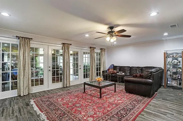 a living room with furniture and a rug