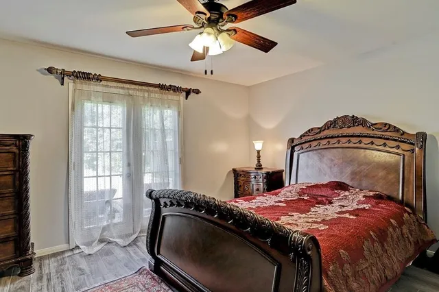 a bedroom with a bed and window