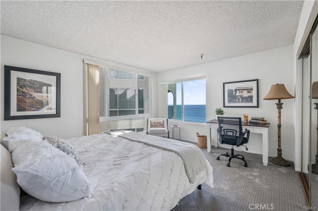565 Esplanade, Unit 308 Redondo Beach, CA 90277 - Photo 12 of 28 a bedroom with a bed and a desk