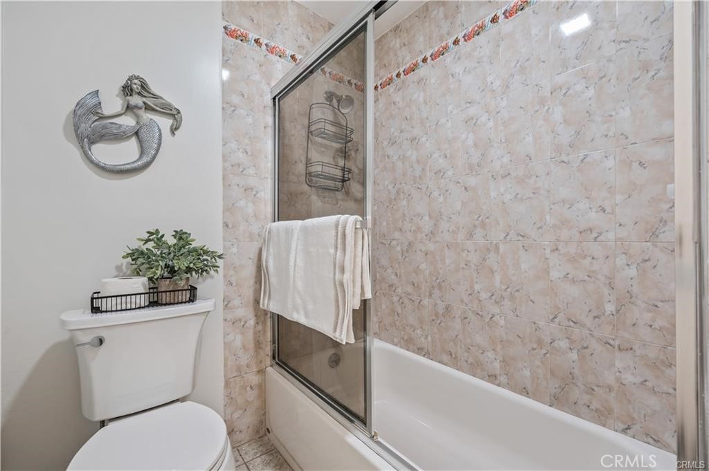 565 Esplanade, Unit 308 Redondo Beach, CA 90277 - Photo 15 of 28 a bathroom with a toilet and a shower
