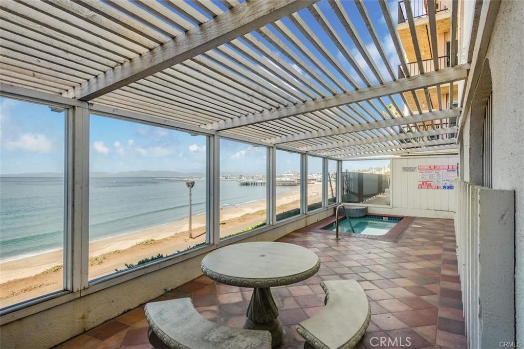 565 Esplanade, Unit 308 Redondo Beach, CA 90277 - Photo 21 of 28 a room with furniture and large windows