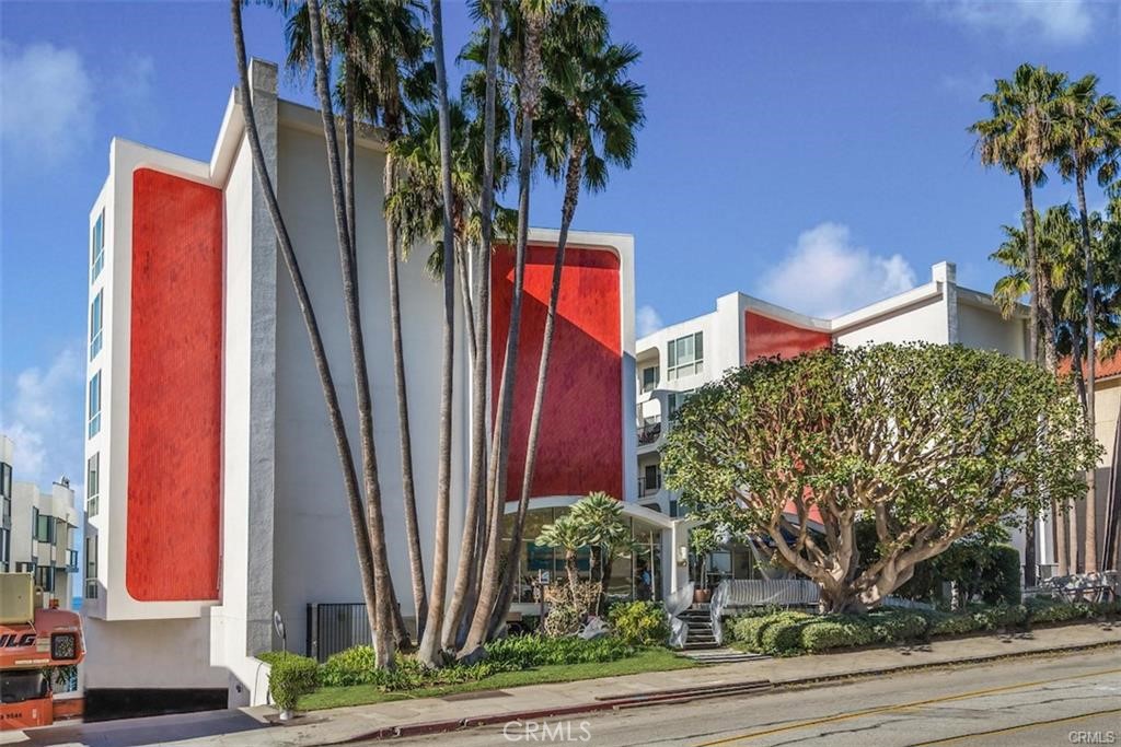 565 Esplanade, Unit 308 Redondo Beach, CA 90277 - Photo 23 of 28 a view of a palm trees front of a house