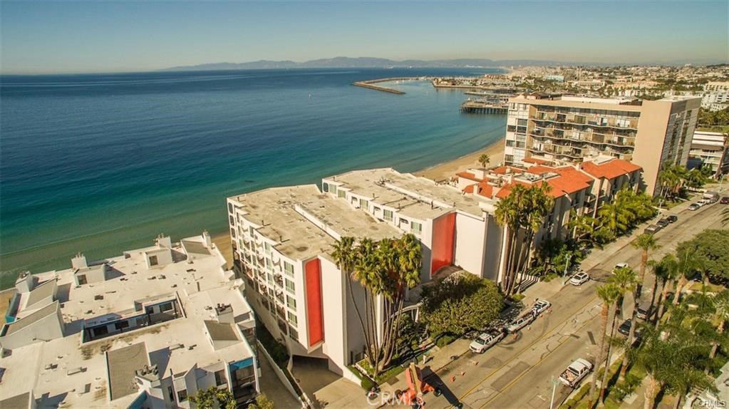 565 Esplanade, Unit 308 Redondo Beach, CA 90277 - Photo 26 of 28 a view of a lake with building in front of it