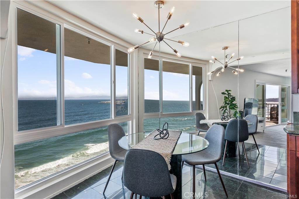 565 Esplanade, Unit 308 Redondo Beach, CA 90277 - Photo 7 of 28 a view of a dining room with furniture window and wooden floor