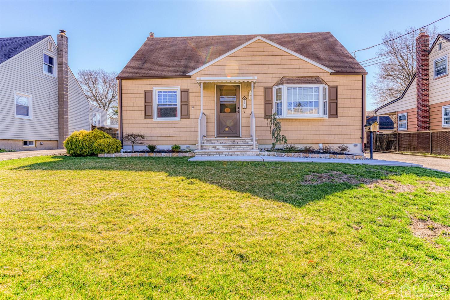 154 East Hill Road Colonia, NJ 07067 - Photo 2 of 25 a view of a house with a swimming pool