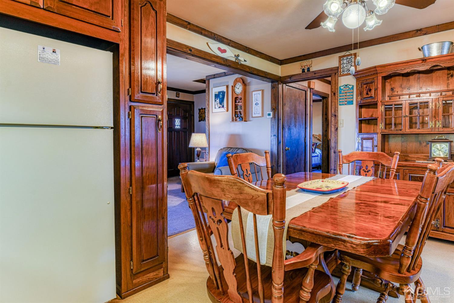 154 East Hill Road Colonia, NJ 07067 - Photo 11 of 25 a dining room with furniture and a chandelier