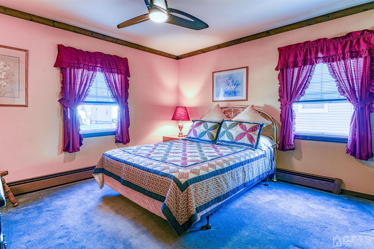 154 East Hill Road Colonia, NJ 07067 - Photo 15 of 25 a bedroom with a bed and window