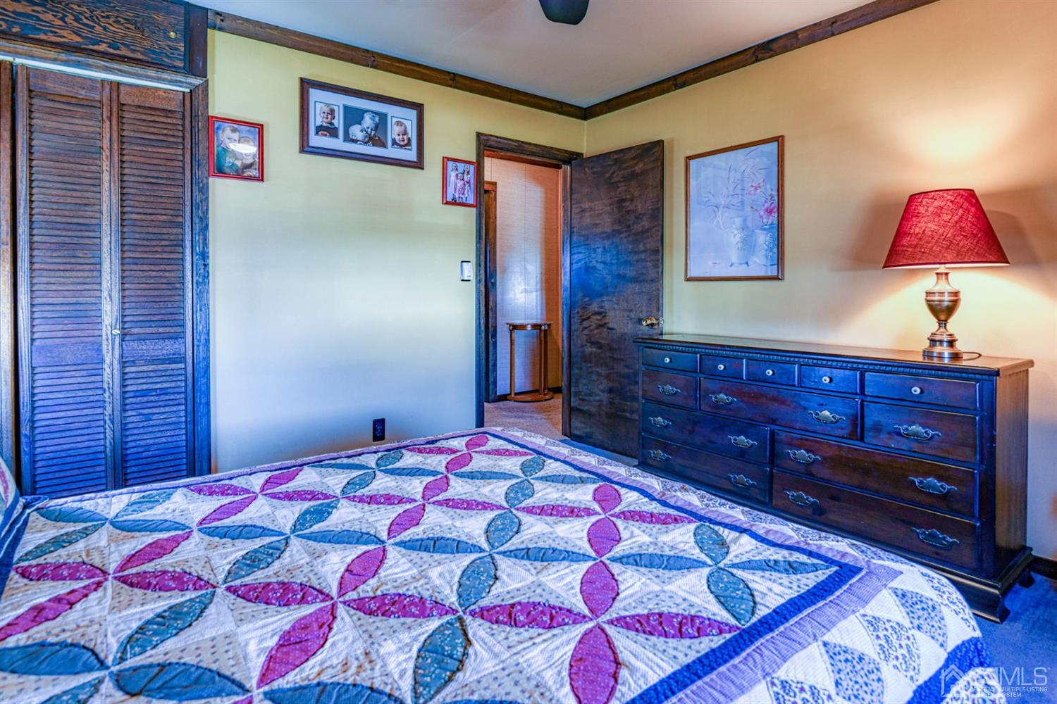 154 East Hill Road Colonia, NJ 07067 - Photo 16 of 25 a bedroom with a bed and a lamp on dresser