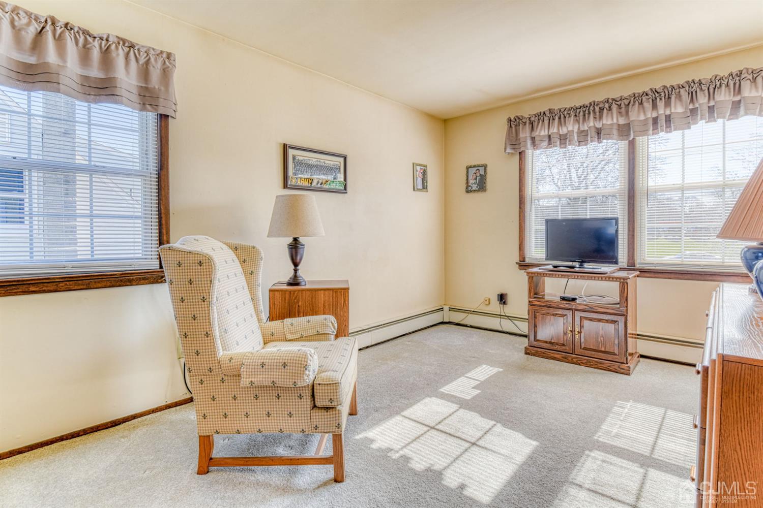 154 East Hill Road Colonia, NJ 07067 - Photo 21 of 25 a living room with furniture and a flat screen tv