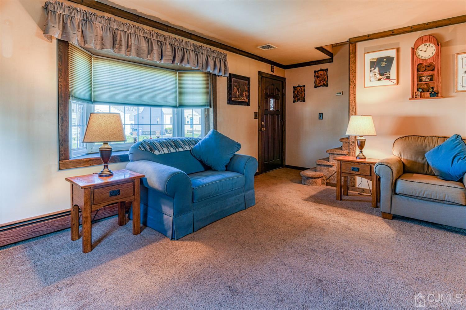 154 East Hill Road Colonia, NJ 07067 - Photo 5 of 25 a living room with furniture and a window
