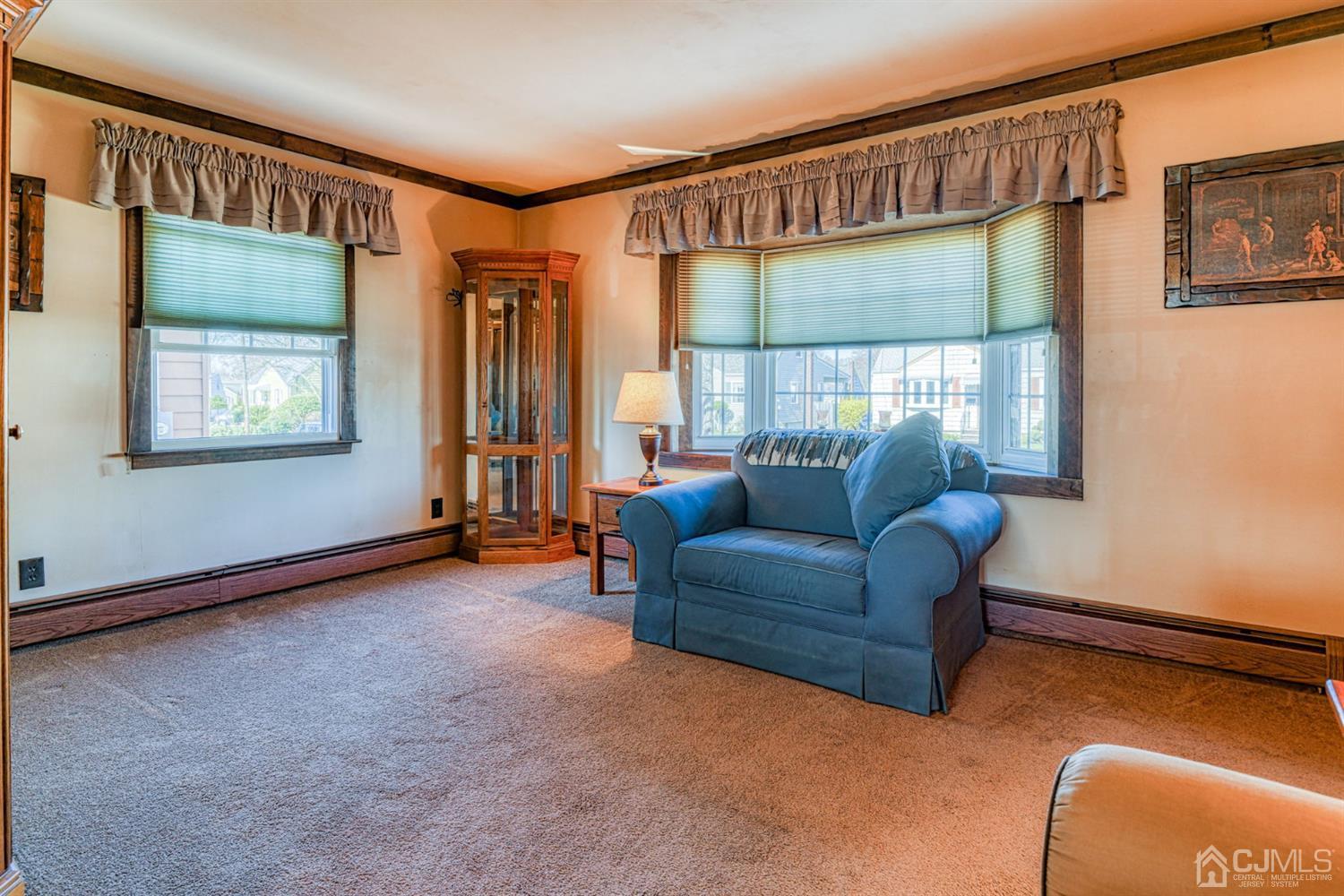 154 East Hill Road Colonia, NJ 07067 - Photo 6 of 25 a living room with furniture and a window