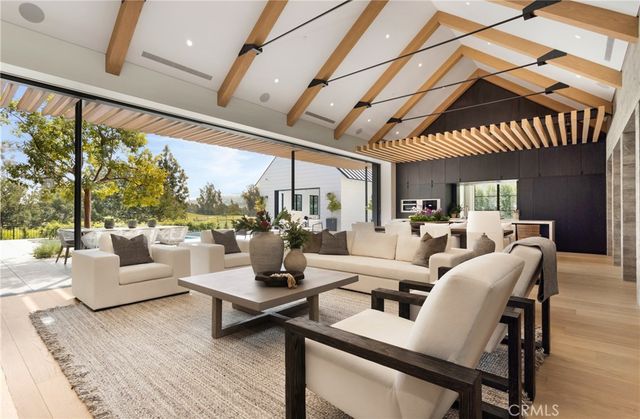 a large white kitchen with a large window