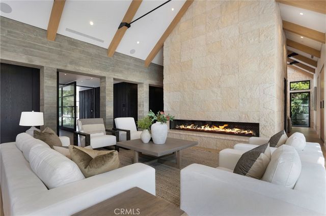 an aerial view of house with yard swimming pool and outdoor seating