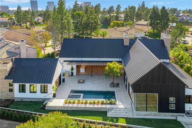 a aerial view of a house with a ocean view