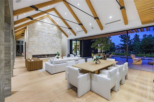 a large white kitchen with a large window
